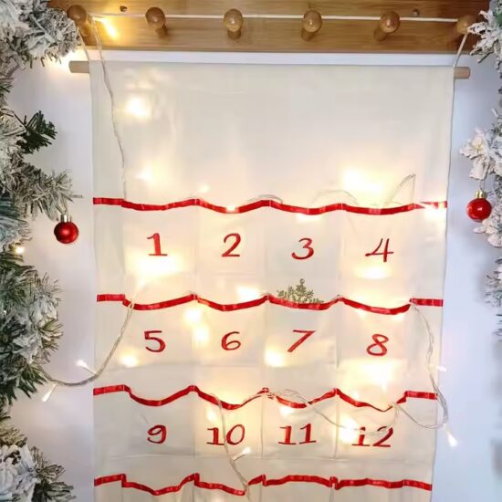 Canvas wall pocket calendar organizer with monthly layout and storage compartments
